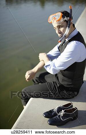 Business man in mask & snorkel by river View Large Photo Image Stock Image - Business man in mask & snorkel by river. Fotosearch