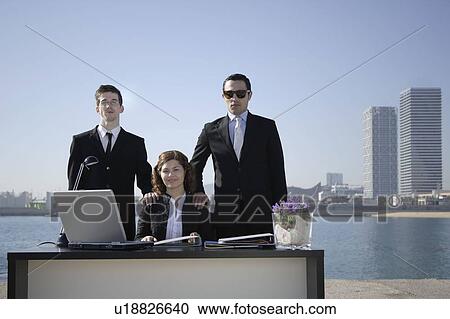 Stock Image - Business team in outdoor office. Fotosearch