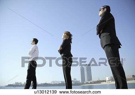 Business team looking towards horizon View Large Photo Image Stock Photo - Business team looking towards horizon. Fotosearch