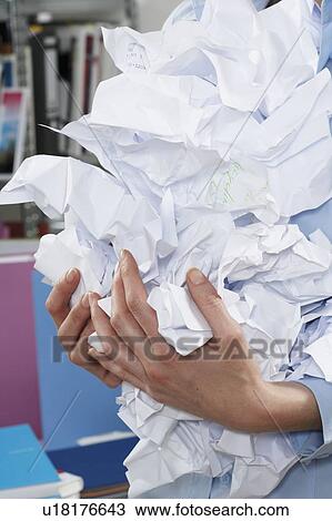 Businesswoman holding crumpled paper View Large Photo Image Stock Image - Businesswoman holding crumpled paper. Fotosearch