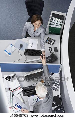 Colleagues sharing phone View Large Photo Image Stock Image - Colleagues sharing phone. Fotosearch
