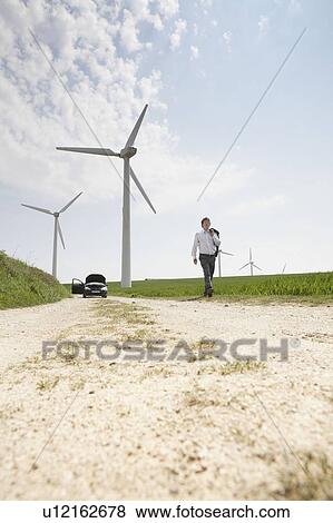 Man walking away from broken down car View Large Photo Image Stock Photo - Man walking away from broken down car. Fotosearch