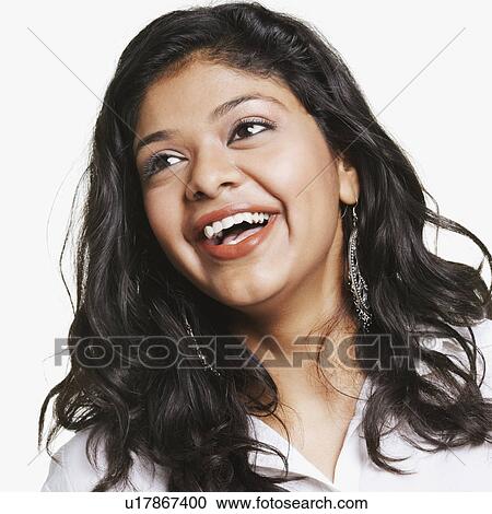 Stock Image - Close-up of a young woman laughing. Fotosearch