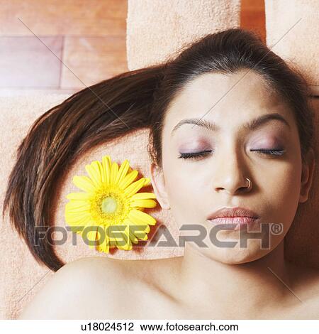 Stock Image - Close-up of a young woman sleeping. Fotosearch