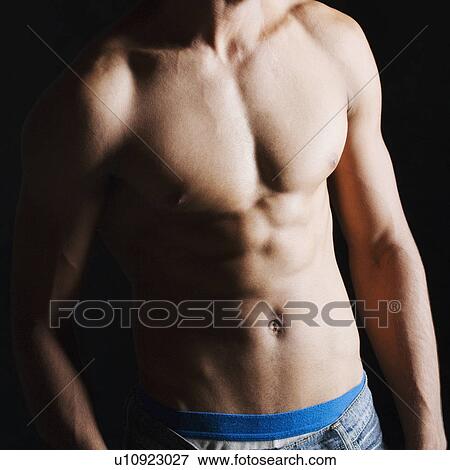 Mid section view of a man View Large Photo Image Stock Photo - Mid section view of a man. Fotosearch