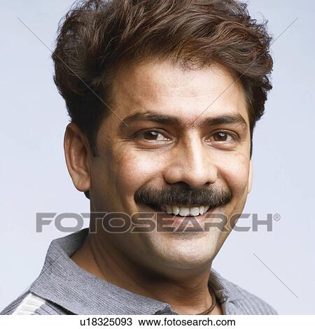 Stock Image - Portrait of a mid adult man smiling. Fotosearch