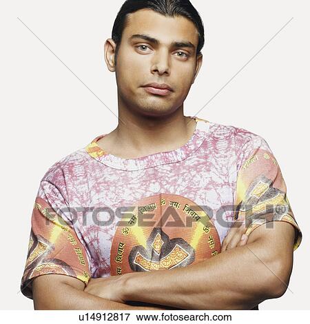 Stock Photo - Portrait of a young man looking serious. Fotosearch