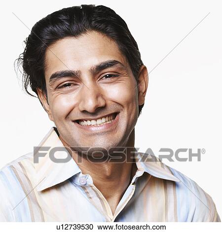 Stock Image - Portrait of a young man smiling. Fotosearch