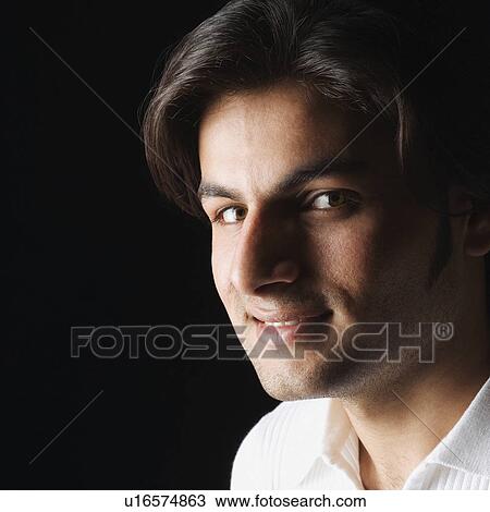 Portrait of a young man smiling View Large Photo Image Stock Image - Portrait of a young man smiling. Fotosearch