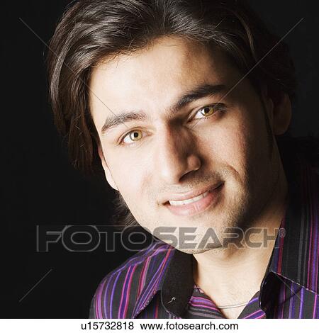 Stock Photo - Portrait of a young man smiling. Fotosearch