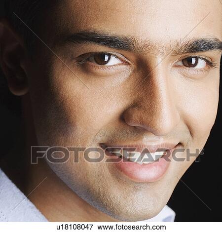 Stock Photo - Portrait of a young man smiling. Fotosearch