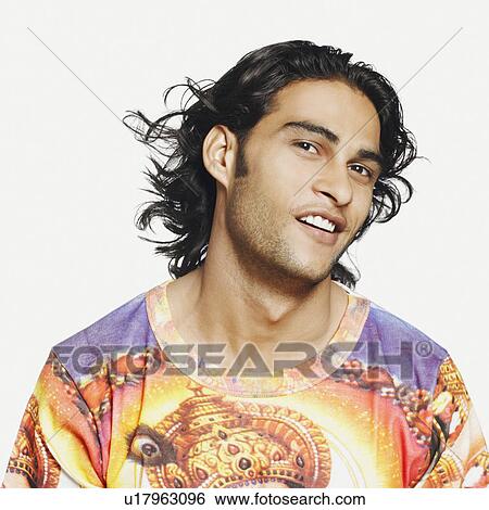 Portrait of a young man smiling View Large Photo Image Stock Photograph - Portrait of a young man smiling. Fotosearch