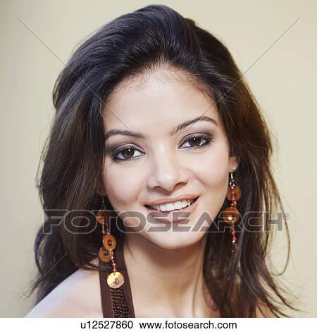 Stock Image - Portrait of a young woman smiling. Fotosearch