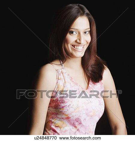 Stock Image - Portrait of a young woman smiling. Fotosearch