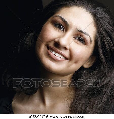 Stock Photo - Portrait of a young woman smiling. Fotosearch