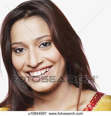 Stock Photo - Portrait of a young woman smiling. Fotosearch