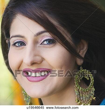 Stock Photography - Portrait of a young woman smiling. Fotosearch