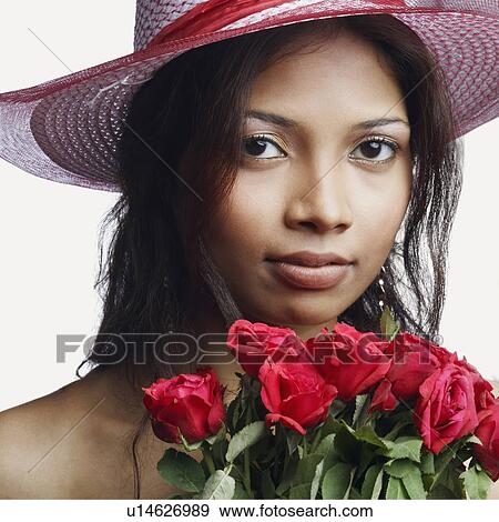 Portrait of a young woman with a bunch of roses View Large Photo Image Stock Photo - Portrait of a young woman with a bunch of roses. Fotosearch