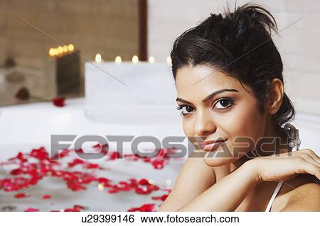 Portrait of a young woman in a bathtub and smiling View Large Photo Image Stock Photograph - Portrait of a young woman in a bathtub and smiling. Fotosearch