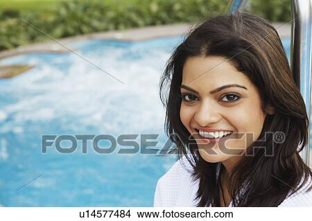 Portrait of a young woman smiling View Large Photo Image Picture - Portrait of a young woman smiling. Fotosearch