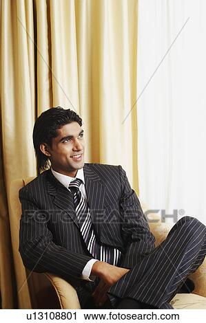 Stock Image - Businessman looking away. Fotosearch