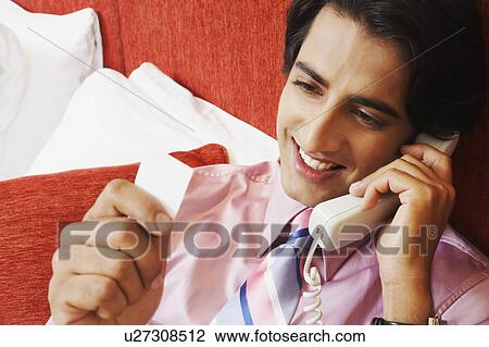 Close-up of a businessman talking on the telephone View Large Photo Image Stock Image - Close-up of a businessman talking on the telephone. Fotosearch