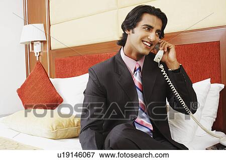 Close-up of a businessman talking on the telephone View Large Photo Image Stock Photo - Close-up of a businessman talking on the telephone. Fotosearch