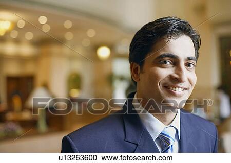 Stock Image - Portrait of a businessman smiling. Fotosearch