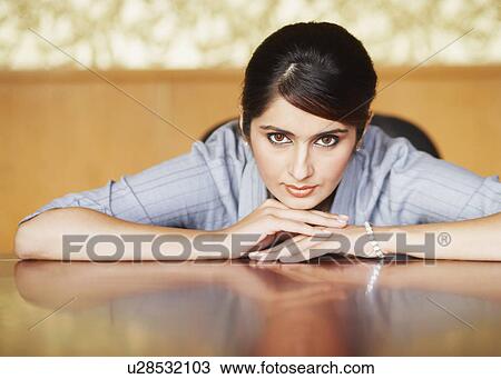 Stock Image - Portrait of a businesswoman thinking. Fotosearch