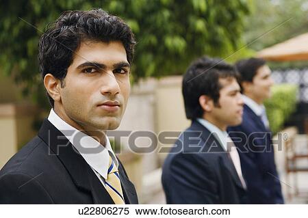 Stock Photography - Portrait of a businessman looking serious. Fotosearch