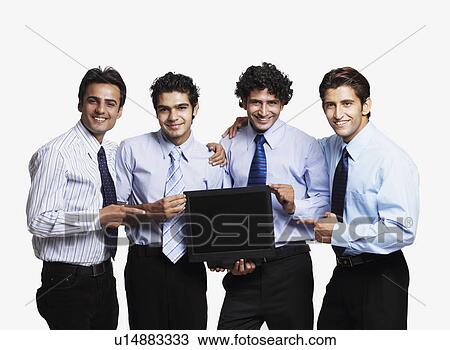 Portrait of four businessmen showing a flat screen computer monitor and smiling View Large Photo Image Stock Image - Portrait of four businessmen showing a flat screen computer monitor and smiling. Fotosearch