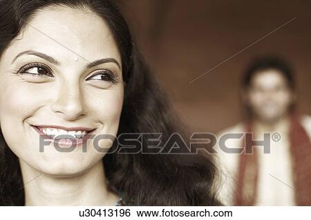 Stock Photograph - Close-up of a young woman smiling. Fotosearch