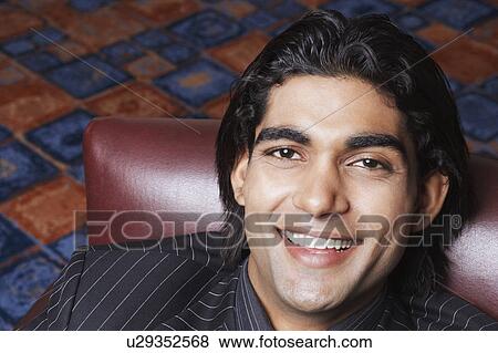 Stock Photo - Portrait of a businessman smiling. Fotosearch