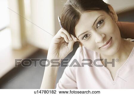 Stock Image - Portrait of a businesswoman smiling. Fotosearch
