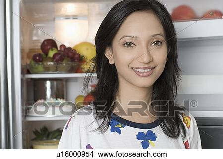 Picture - Portrait of a young woman smiling. Fotosearch