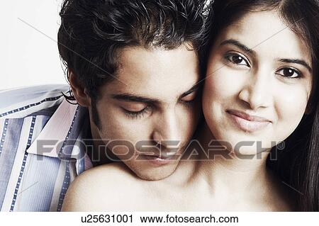 Portrait of a young woman with a young man View Large Photo Image Stock Image - Portrait of a young woman with a young man. Fotosearch