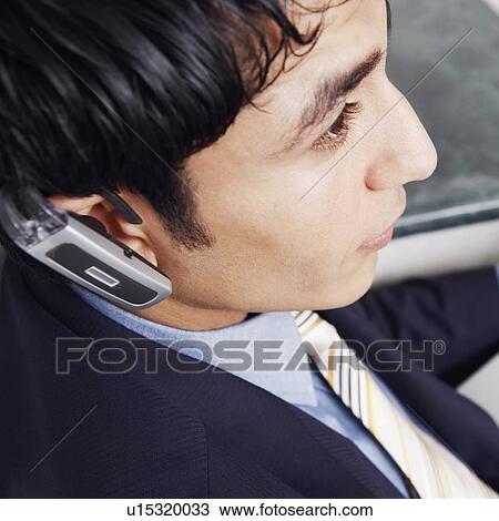 Close-up of a businessman using a laptop View Large Photo Image Stock Image - Close-up of a businessman using a laptop. Fotosearch
