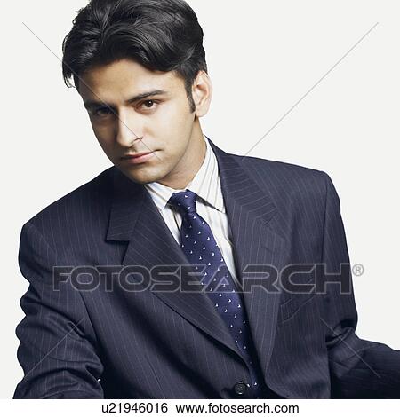 Portrait of a businessman looking serious View Large Photo Image Stock Photograph - Portrait of a businessman looking serious. Fotosearch