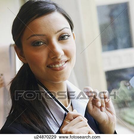 Stock Photo - Portrait of a businesswoman smiling. Fotosearch