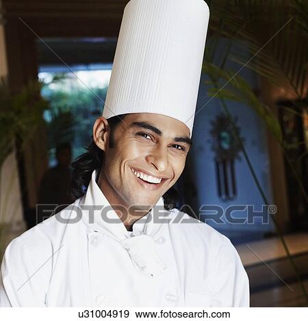 Portrait of a chef smiling View Large Photo Image Stock Photo - Portrait of a chef smiling. Fotosearch