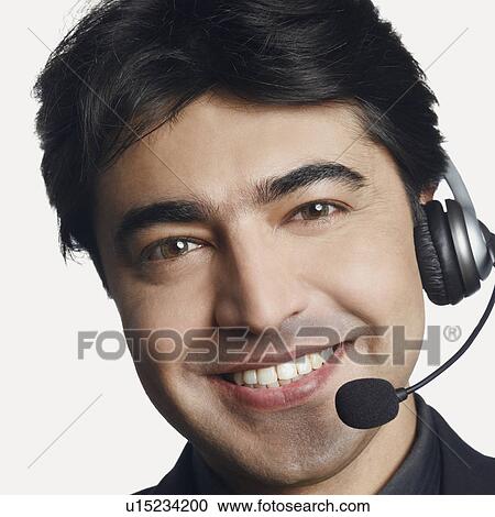 Portrait of a male customer service representative smiling View Large Photo Image Stock Image - Portrait of a male customer service representative smiling. Fotosearch
