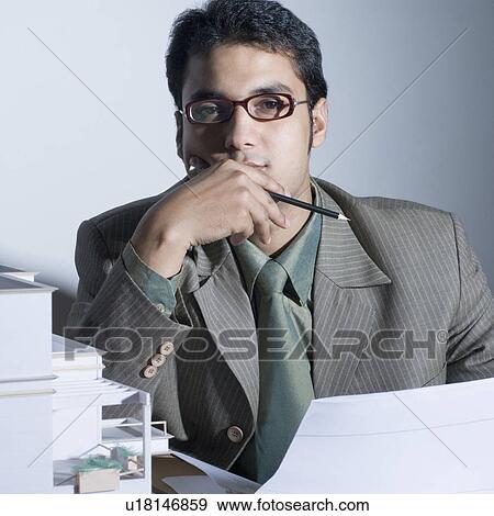 Portrait of an architect thinking View Large Photo Image Stock Photo - Portrait of an architect thinking. Fotosearch