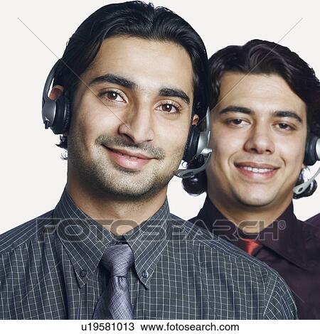 Portrait of two male customer service representatives smiling View Large Photo Image Stock Image - Portrait of two male customer service representatives smiling. Fotosearch