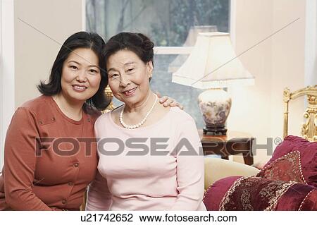 Stock Image - Portrait of a girl and her mother. Fotosearch