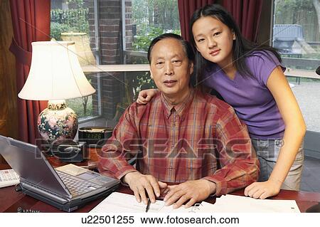 Stock Photography - Close-up of a grandfather and his granddaughter. Fotosearch
