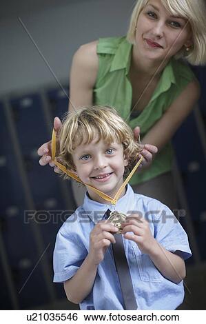 School boy being awarded medal View Large Photo Image Stock Photograph - School boy being awarded medal. Fotosearch