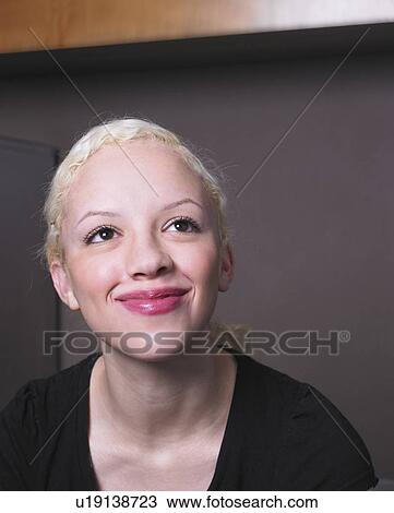 Stock Image - Businesswoman at her desk. Fotosearch