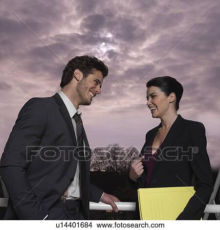 Picture - Couple outdoors, smiling. Fotosearch