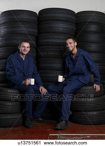 Mechanics on break drinking coffee View Large Photo Image Stock Image - Mechanics on break drinking coffee. Fotosearch