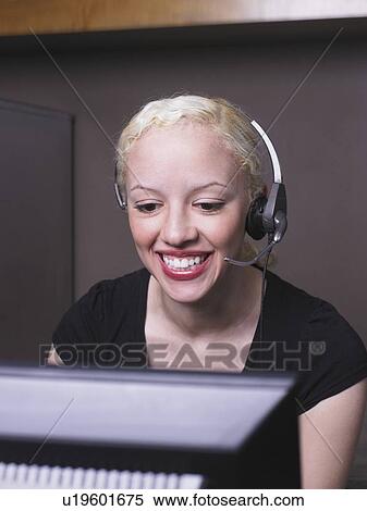 Woman smiling on headset View Large Photo Image Stock Photography - Woman smiling on headset. Fotosearch